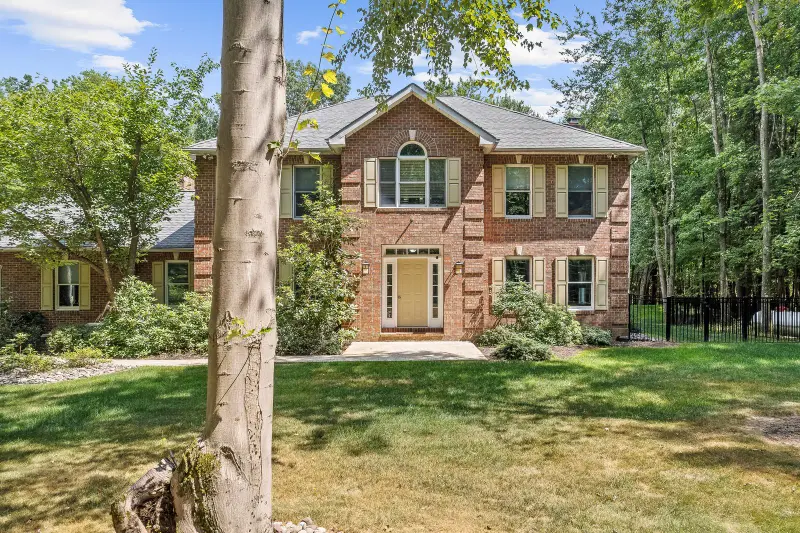 Brick colonial home on a wooded lot in Dallas, Pennsylvania
