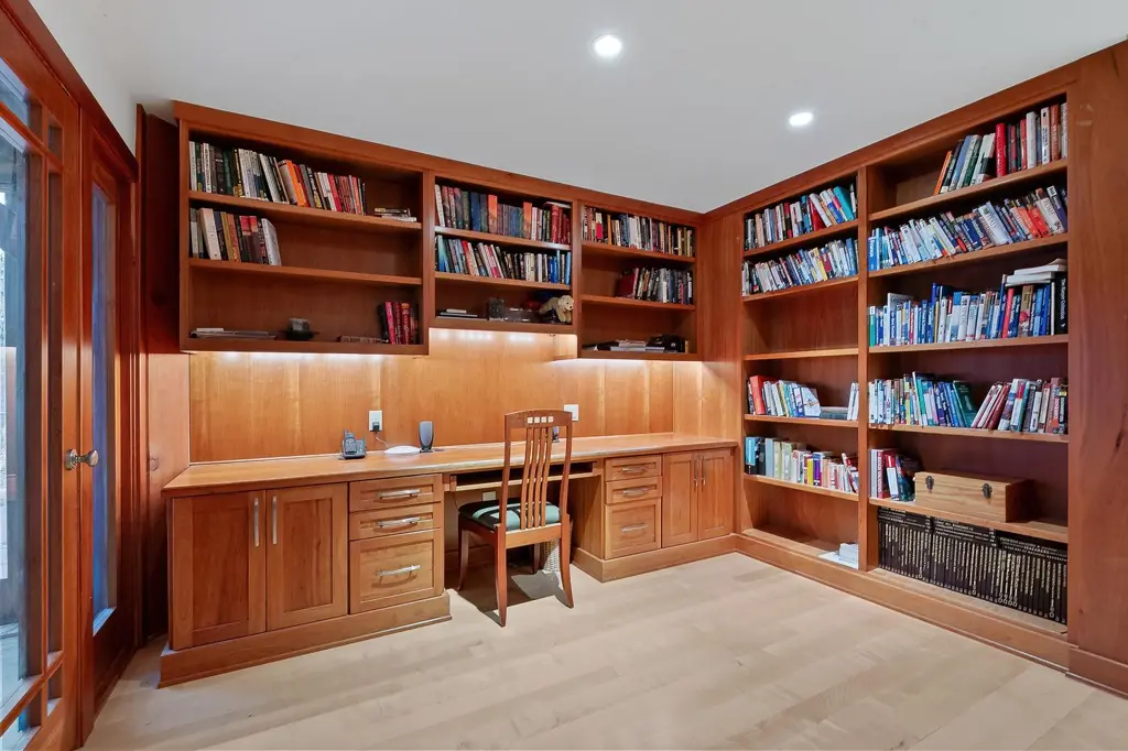 Home office with built-in cherry bookshelves and a desk in a Northeastern Pennsylvania home